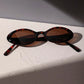 Ovale Retro-Sonnenbrille mit Leopardenmuster